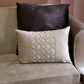 Holly embellished cushion